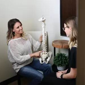 Chiropractor Charleston WV Jennifer Runyan With Patient And Spine